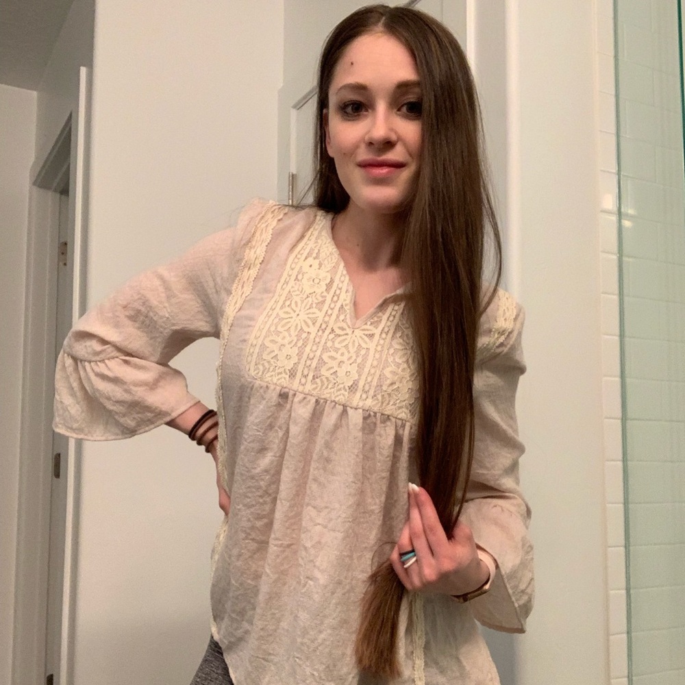 Brand new blouse w/ long sleeves and flared cuffs